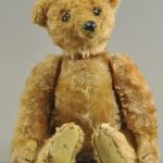 STEIFF ROD TEDDY BEAR WITH ELEPHANT BUTTON