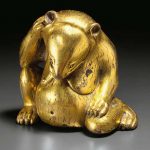 A SUPERB GILT-BRONZE FIGURE OF A SEATED BEAR CHINA, WESTERN HAN DYNASTY (206 BC-AD 8)