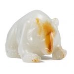 An exceedingly rare and important white and russet jade carving of a bear